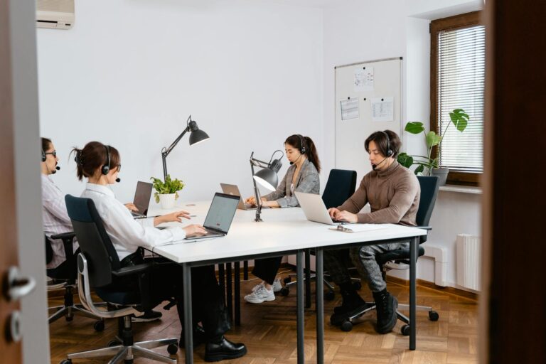 Customer service outsourcing team working in a professional call center